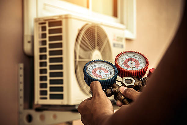 Professional Air Conditioning Service technician working in Fitchburg, WI
